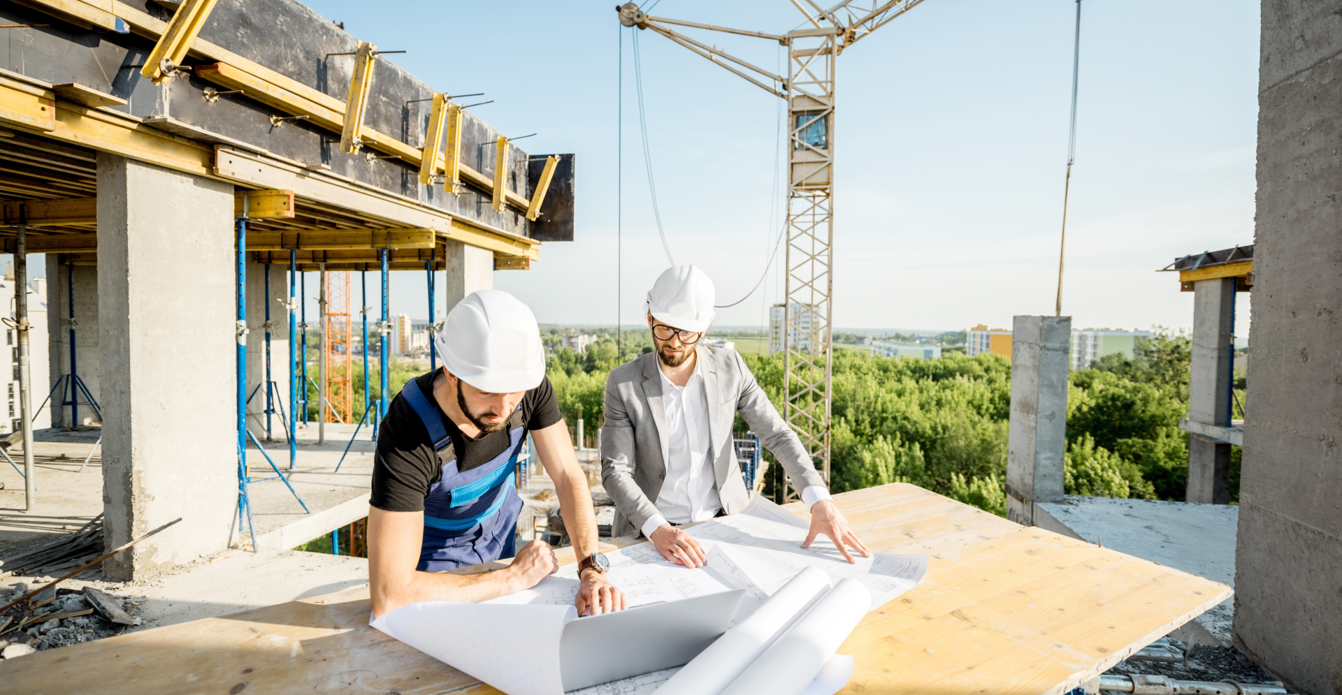 Engineer with worker at construction site